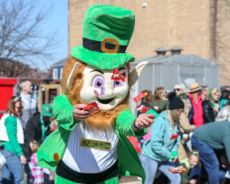 "Lucky" the Leprechaun throws out candy in the Lemont St. Pat's Day Parade on Saturday, March 8, 2025  in Lemont.