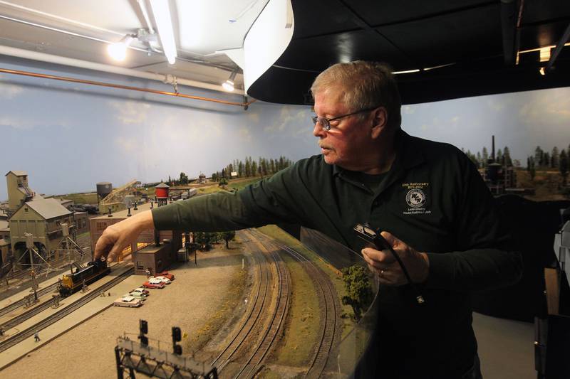 Norm Kocol, of Johnsburg moves a Road Switcher -3 train on the tracks at the Lake County Model Railroad Club in Wauconda. The club is celebrating their 50th anniversary.