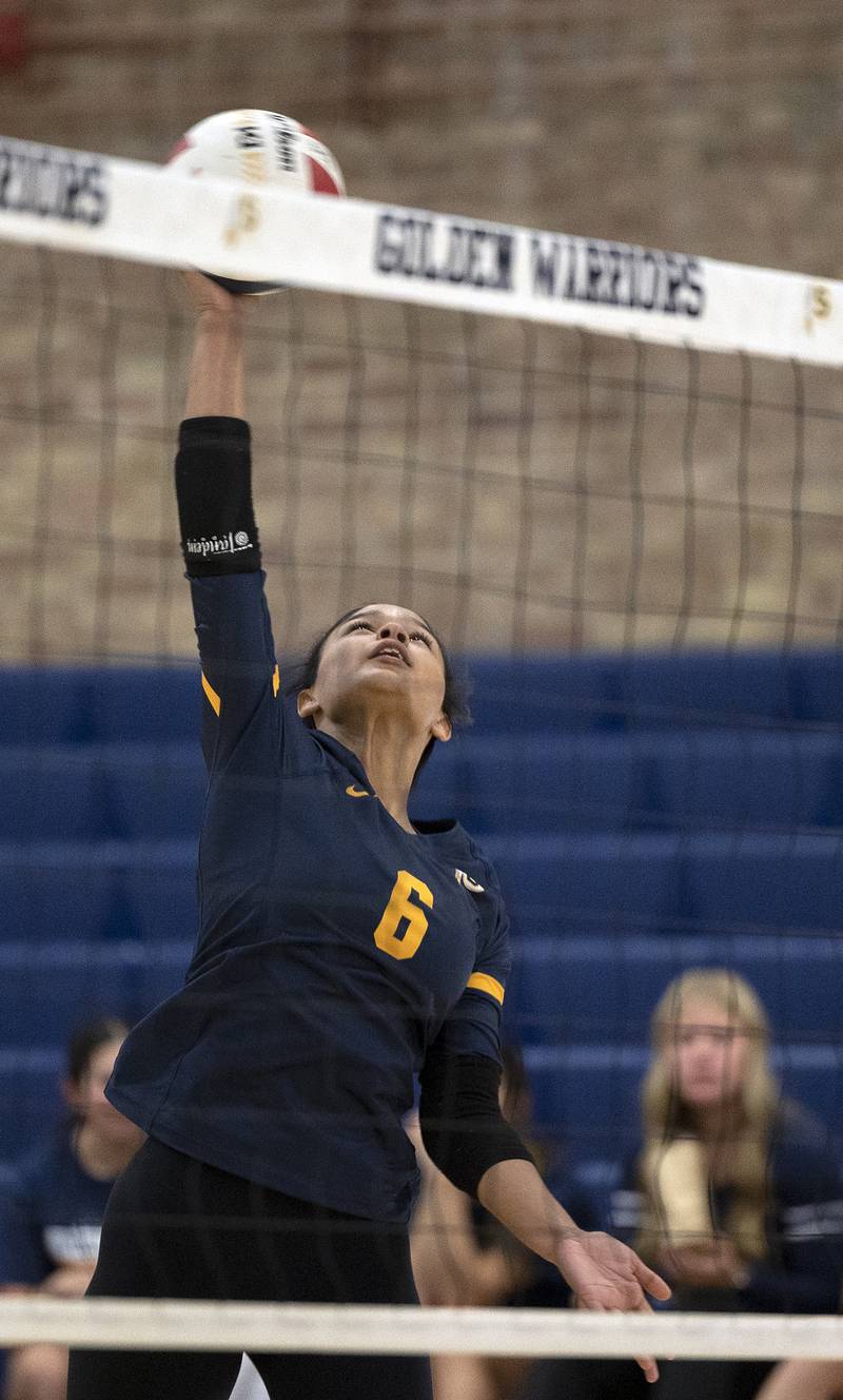 Sterling’s Alasia Harris Rascon hammers the ball against United Township Tuesday, Oct. 15, 2024, in Sterling.