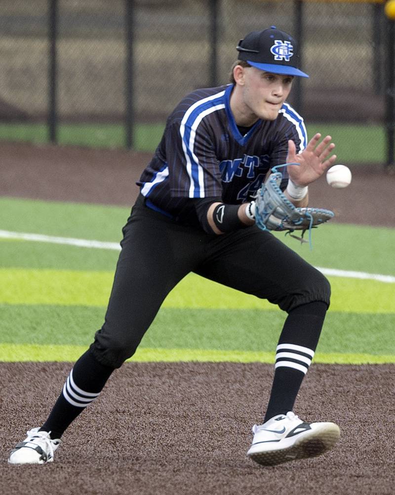 Newman’s Drake Cole field a ball at first for an out against Sterling Tuesday, March 18, 2025.