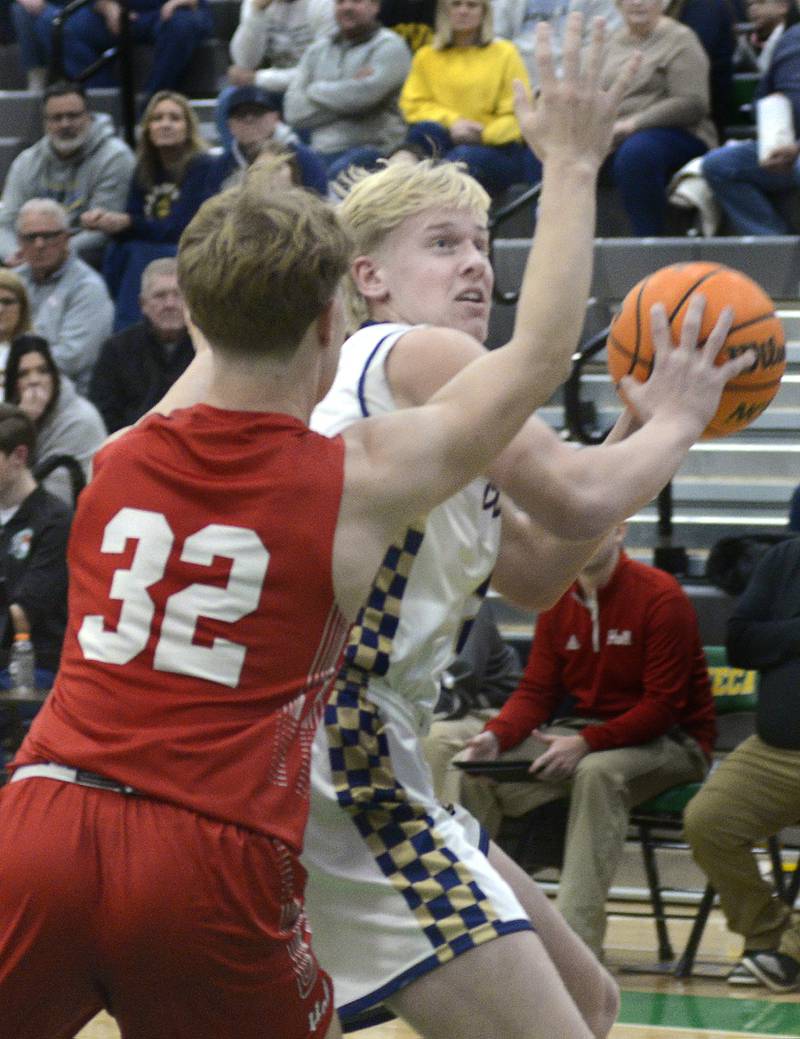 Marquette’s Luke McCullough works to get around Hall defender Chace Sterling (32) Saturday, Dec. 27, 2025, during the third-place game of Seneca's Shipyard Showdown.