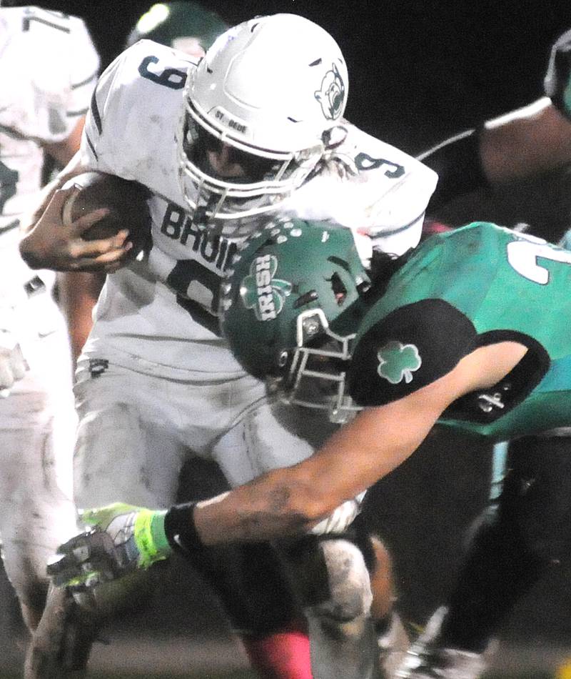St. Bede quarterback Max Bray is tackled by Seneca's Kysen Klinker at Seneca on Friday, Oct. 20, 2023.