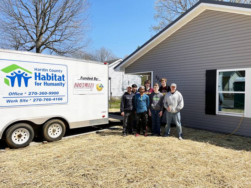 Montini Catholic's team in front of their completed home: l to r:  Mr. Denis Block, David Hernandez (Westchester), Howard Hall (Romeoville), Blake Holtquist (Lombard), Zander Montgomery (Lomard), Henry Dawson (Villa Park) and Mr. Barry Briggs