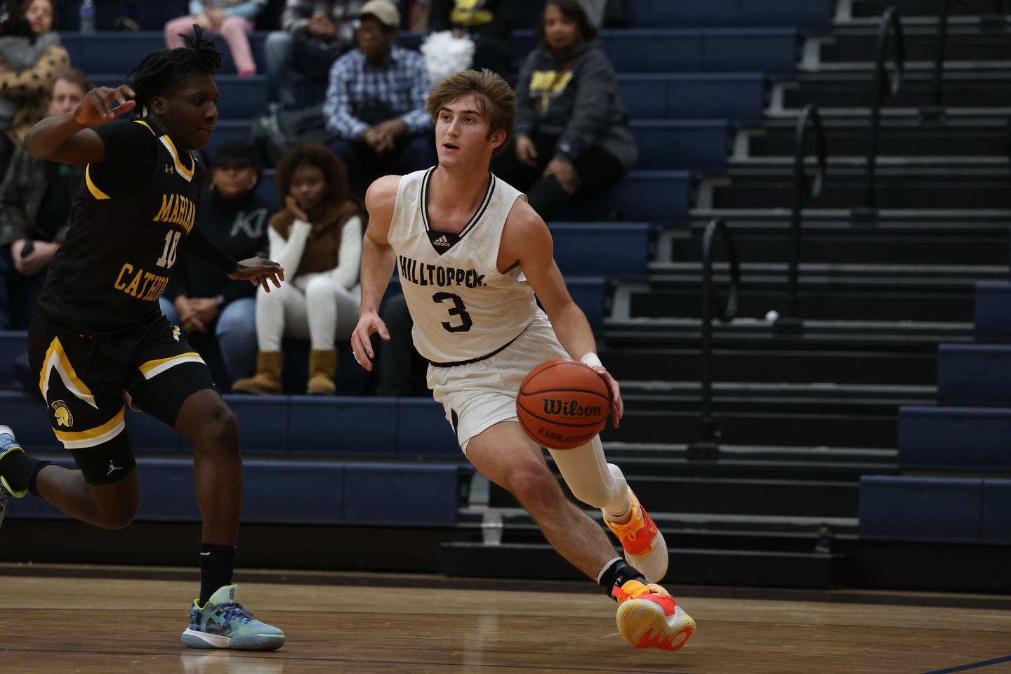 Joliet Catholic’s Tyler Surin drives along the baseline against Marian Catholic on Friday January 27th, 2023.