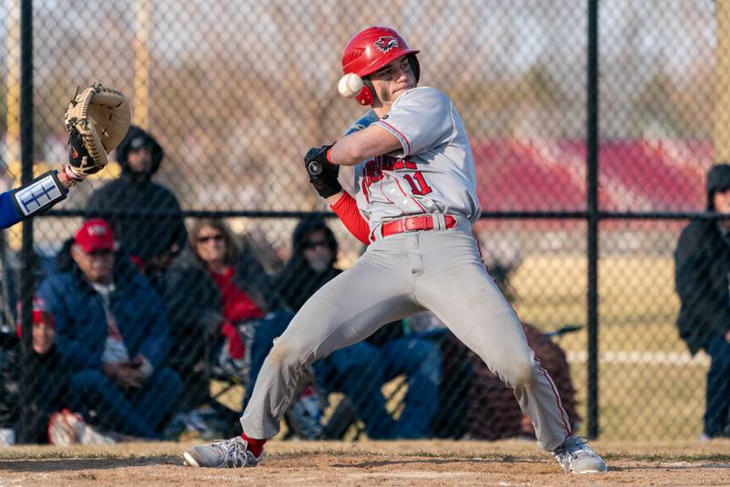 Yorkville's Sebastian Westphal (11) leans back to avoid a pitch by Marmion's Connor Tulley (not pictured) during a baseball game at Marmion High School in Aurora on Tuesday, Mar 28, 2023.