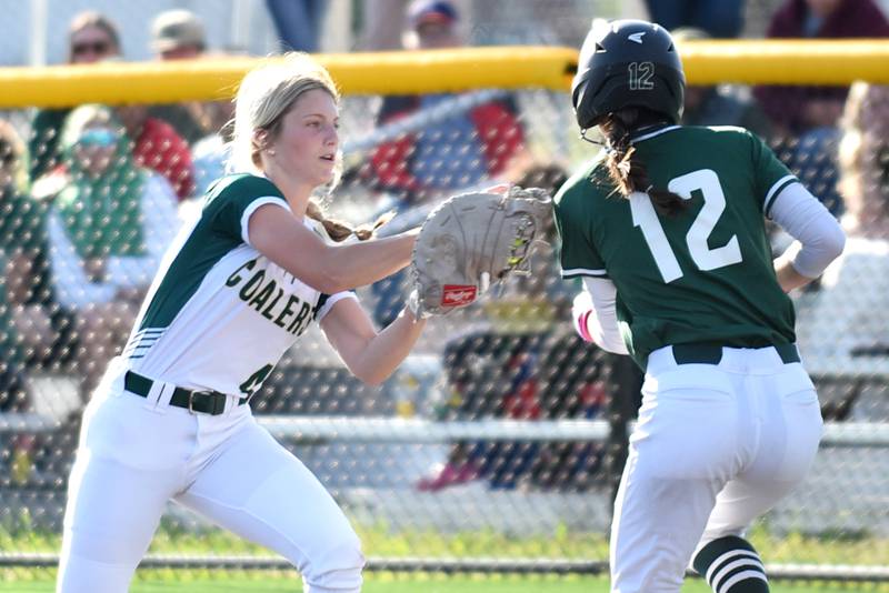 Coal City's Addison Harvey, left, applies a tag on Bishop McNamara's Analeah Ramirez during the Class 2A Coal City Regional championship Friday, May 23, 2025.