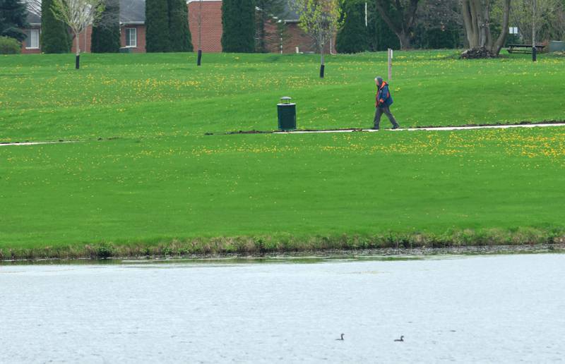 An aerial view of the walking path on Thursday, April 16, 2026 in Peru. The project is now complete and open to the public. Construction work began last October and included a 10-foot-wide concrete path, with secondary concrete paths also added, connecting the new parking lot near Lighted Way to the parking lot, playground, and shelter on the west side of Baker Lake. The new path is 2 feet than the current one.