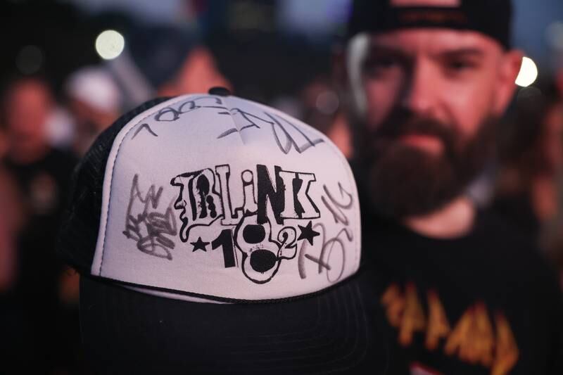 Roman Kokozka, of Chicago, saw Green Day and Blink-182 while in high school, his was able to get autographs from Green Day and 20 years later his is hoping on the rare chance to get Blink-182 to sign the hat while at Lollapalooza on Sunday, Aug. 4, 2024 in Chicago.