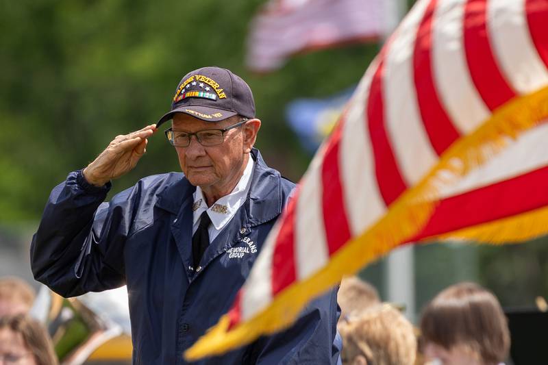 Mike Mallie of the Peru Honor Guard salutes on Monday, May 26, 2025 at Washington Park in Peru.