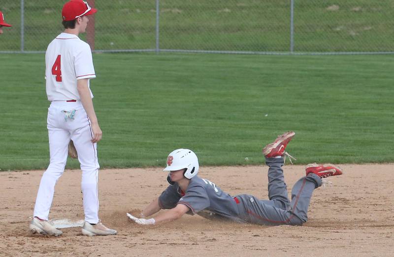 L-P's Jett Hill slides into second base as Ottawa's Colt Bryson watches the play on Friday, May 2, 2025 at Ottawa High School.