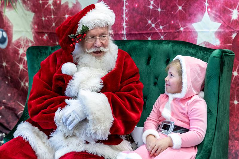 Lockport resident Melody Soltero tells Santa what she would like for Christmas at the White Oak Library District’s Lockport Branch during Lockport’s Christmas in the Square festivities on Nov. 29, 2025.