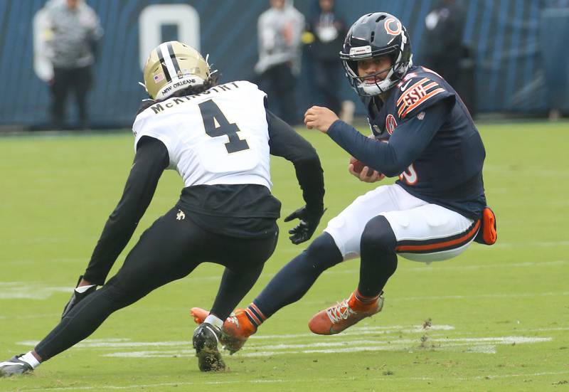Chicago Bears quarterback Caleb Williams avoids the sack from New Orleans corner back Kool-Aid McKinstry on Sunday, Oct .11, 2025 at Soldier Field in Chicago.