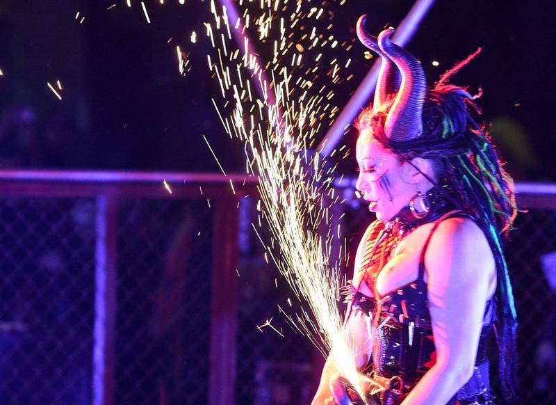 Sparks fly as Lady India performs at the Thunderdome Saturday during Nightmare on Chicago Street in downtown Elgin.