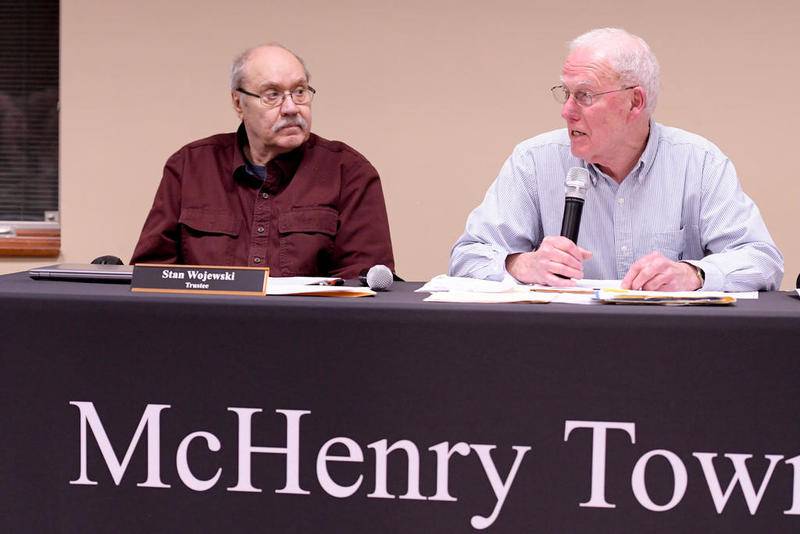Trustee Bob Anderson (right) presides over the monthly McHenry Township Board meeting Dec. 12 in Johnsburg.