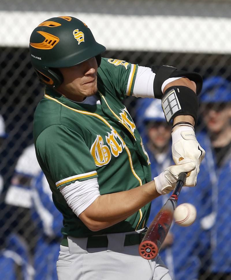 Crystal Lake South's C.J. Regillio hits a three-run homer during a Fox Valley Conference baseball game against Burlington Central on Friday, April 12, 2024, at Burlington Central High School.