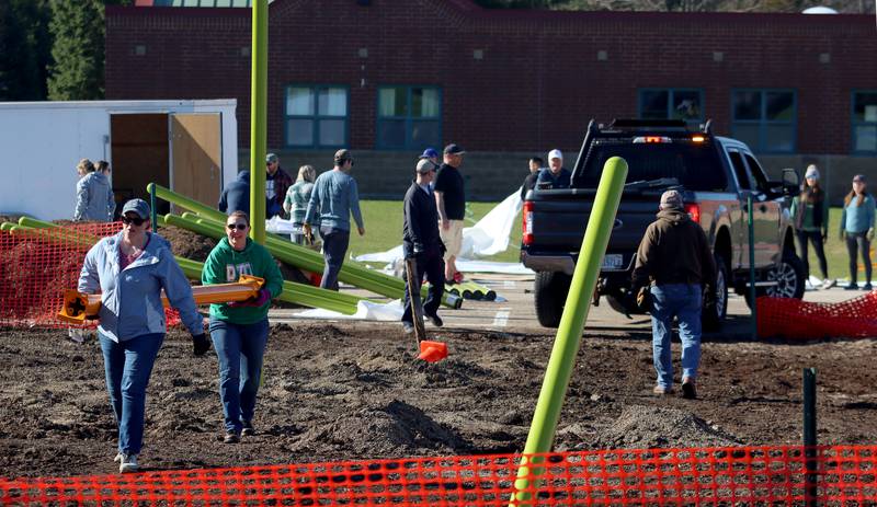 Volunteers and friends of Three Oaks Elementary School constructed a new playground at the Cary school on Saturday.