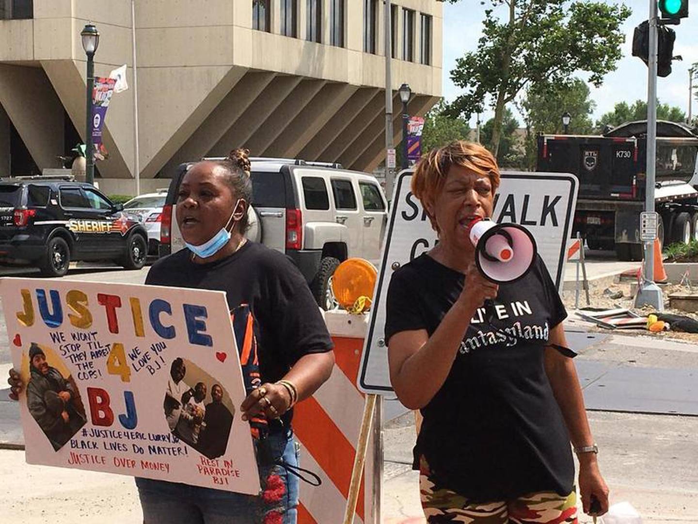 Protesters hold rally against Will County State's Attorney James Glasgow in response to the death of Eric Lurry on Monday, Aug. 10, 2020, in downtown Joliet.