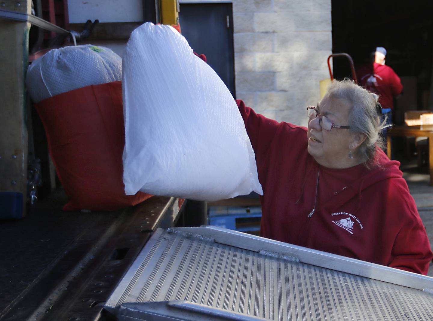 Diane Ahrens at the Operation Sweet Life warehouse on Thursday, Act, 17, 2024, in Elgin. The Operation Sweet Life charity helps furnish veterans homes.