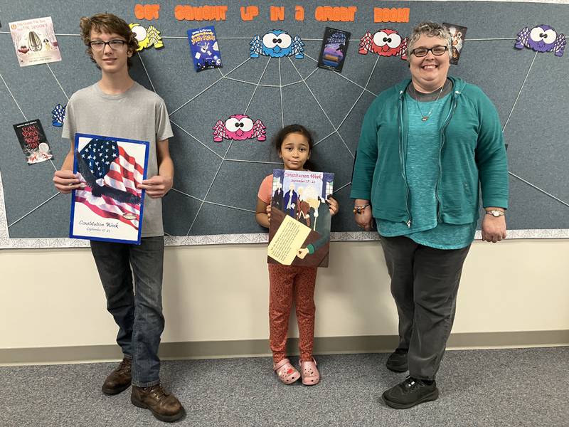 The winners, Jason Peerboom and Aaliyah Beatty, are shown with Sarah Flanagan, Rochelle Chapter regent and library director.