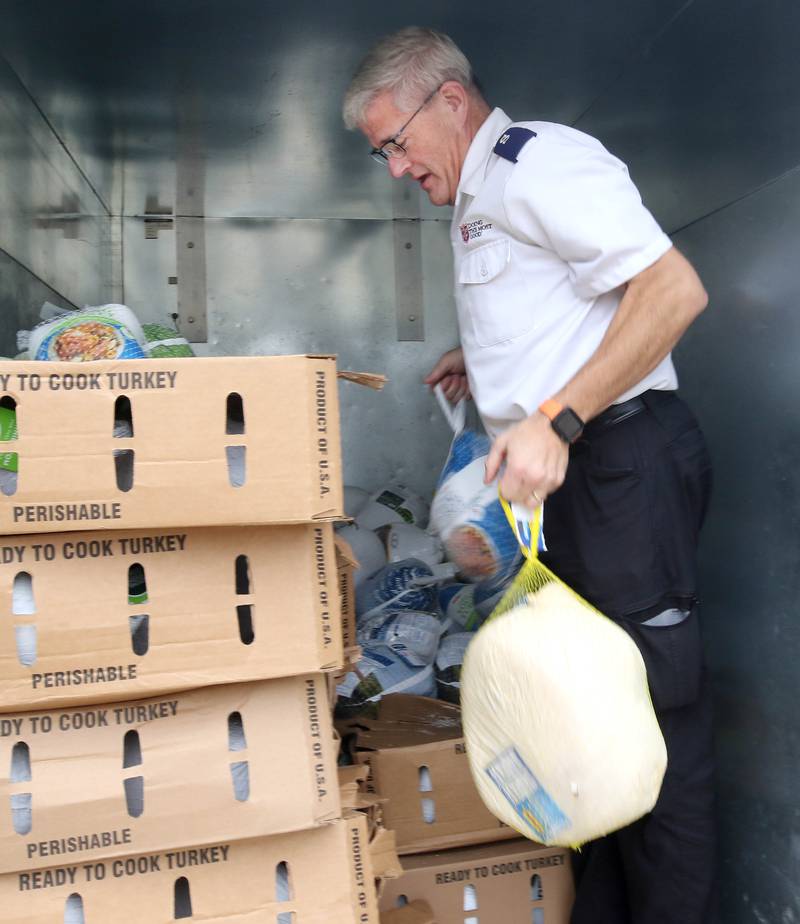 Jim Spencer, corps officer and administrator for the DeKalb Salvation Army, picks up some of the turkeys collected in association with WLBK Friday, Nov. 22, 2024, at their facility during the Let’s Talk Turkey food drive. The campaign accepted turkeys, hams and monetary donations for Thanksgiving meals.
