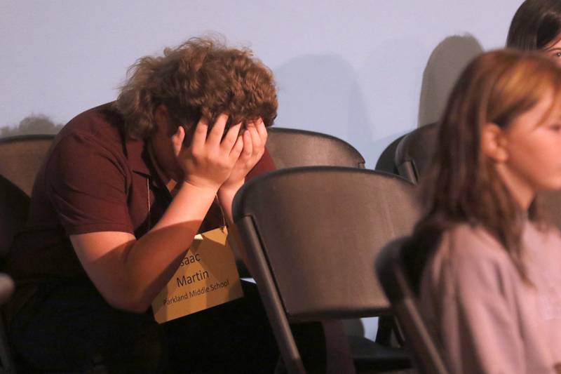 Isaac Martin of Parkland Middle reacts to misspelling a word during the McHenry County Regional Office of Education 2023 Spelling Bee Wednesday, March 22, 2023, at McHenry County College's Luecht Auditorium in Crystal Lake.