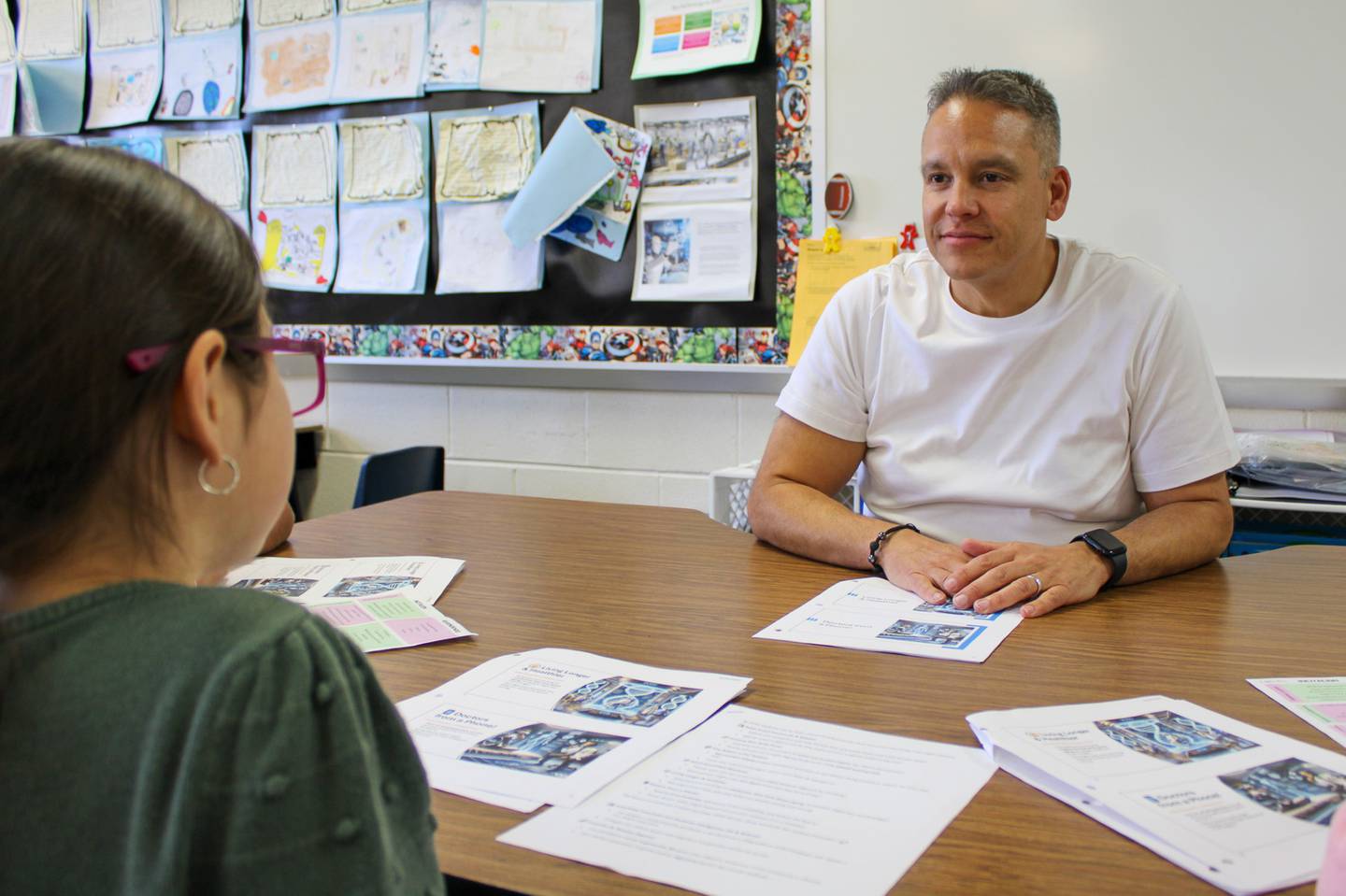 Juan Figueroa, third-grade dual language teacher at Creekside Elementary School, works with students in a small group session on Tuesday, April 8, 2025.