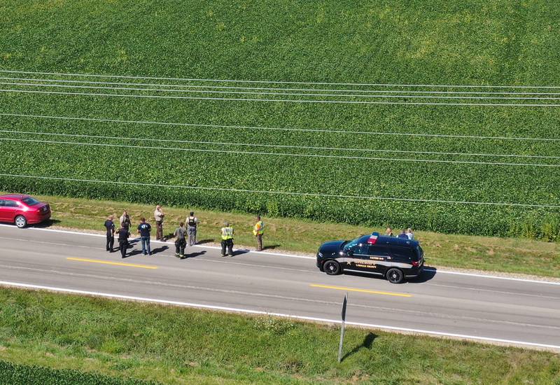 La Salle County Sheriff and other authorities gather along North 33rd Road next to a bean field near Wallace Grade School on Wednesday, Aug. 30, 2023 north of Ottawa. Wallace Fire Department, Illinois State Police and Ottawa Police Department were called to the school shortly after a student who ran ran out of the school and into a cornfield.