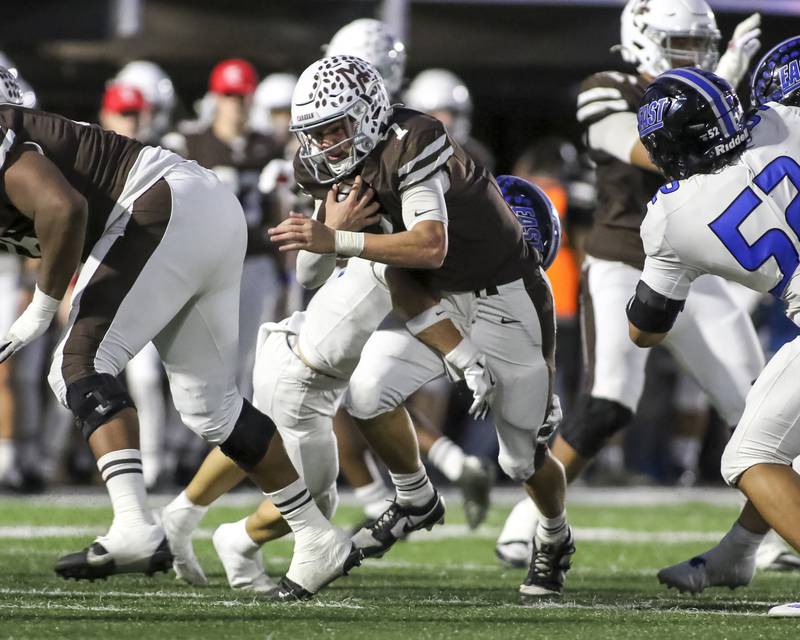Mount Carmel's Emmett Dowling (7) runs up the middle during Class 8A quarterfinal football game between Lincoln-Way East at Mount Carmel. Saturday, Nov 15, 2025 in Chicago.