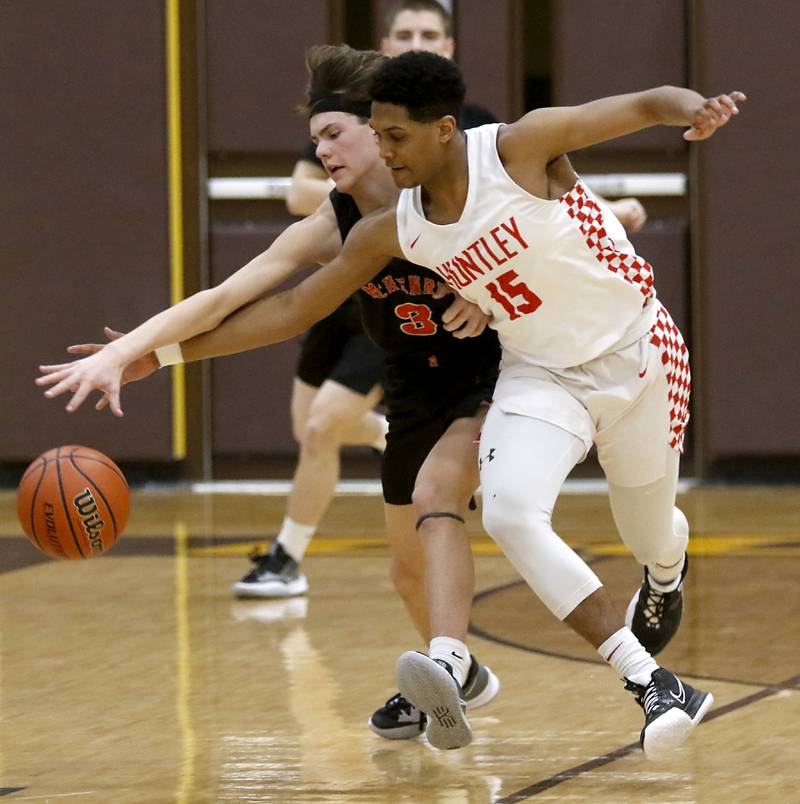Huntley's Noah Only, right steals the ball from McHenry’s Zachary Maness during a IHSA Class 4A Boys Regional basketball game Wednesday, Feb. 23, 2022, between Huntley and McHenry at Jacobs High School.