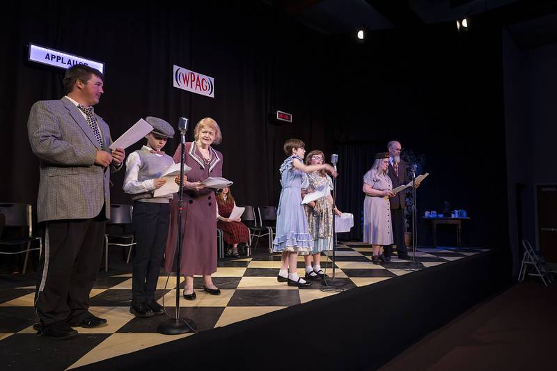 Actors line up for the next scene in The Performing Arts Guild’s rendition of “An Evening Around the Radio” during rehearsal Tuesday, April 18, 2023.