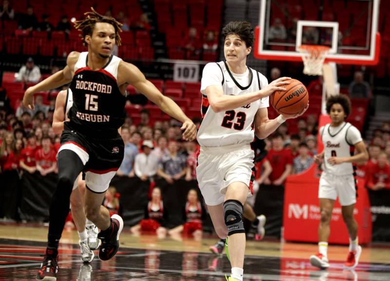 Benet’s Niko Abusara (right) tries to pass the ball away from Rockford Auburn’s Keon Leach (left) during the Class 4A NIU Supersectional against in DeKalb on Monday, March 6, 2023.