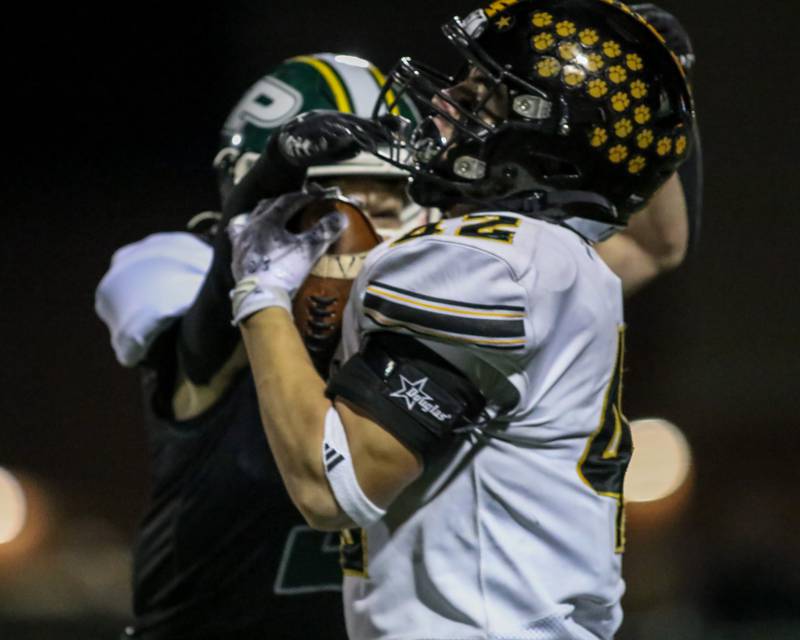 Joliet West's Gavin Garcia (42) hauls in a long reception during football game between Joliet West at Plainfield Central.   Oct 20, 2023.