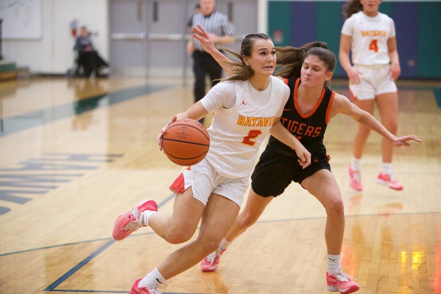 Batavia's Brooke Carlson drives the baseline against Wheaton Warrenville South's Emily Trola at the Class 4A Regional Final on Friday, Feb.26,2024 in Bartlett.