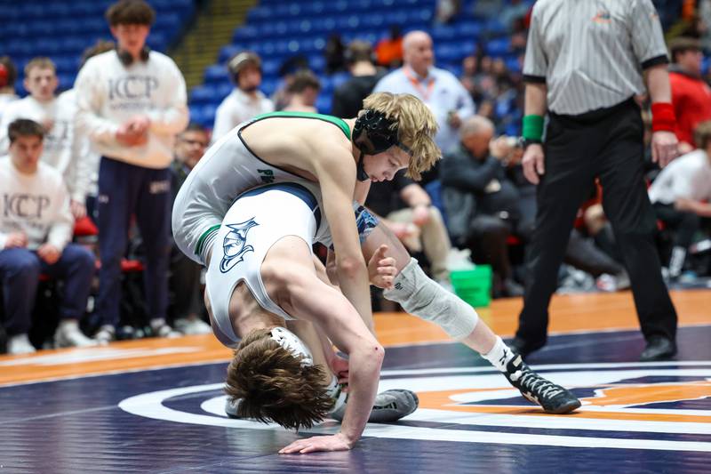 Providence Catholic's Max Mandac, top, pulls down IC Catholic's Sammy Murante in the 126-pound match during IC Catholic's victory in the IHSA Class 2A Dual Team State championship on Saturday, Feb. 28, 2026.