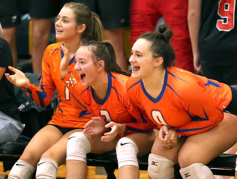 The Genoa-Kingston bench celebrates a point during their match against Sycamore Monday, Aug. 28, 2023, at Sycamore High School.