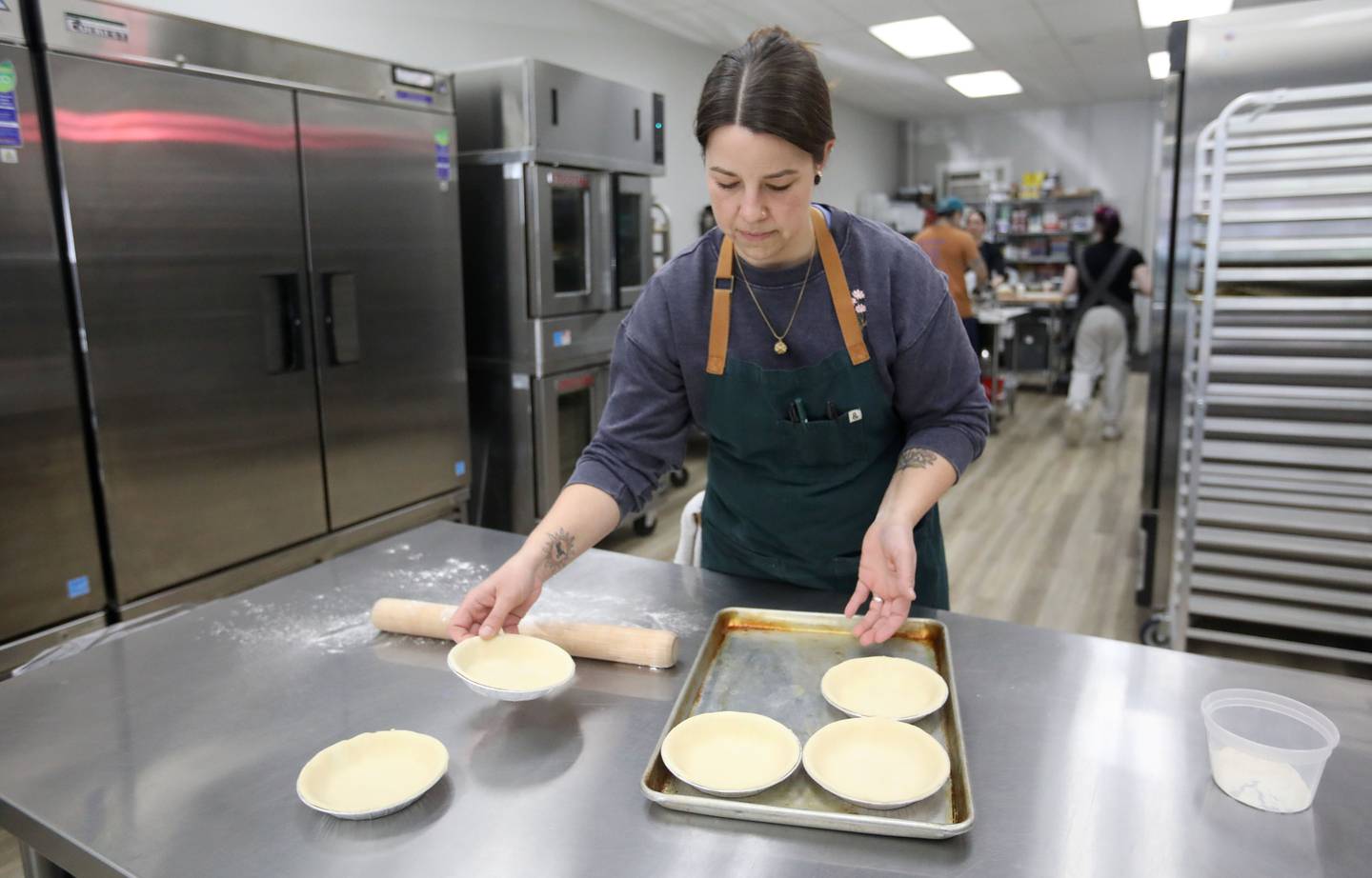 Stephanie Martin of Black Market Bakery prepares pie shells on Thursday, March 12, 2026, as the bakery prepares for Pi Day on March 14, at the bakery in Crystal Lake.