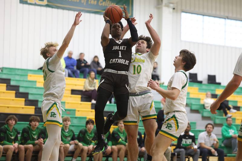 Joliet Catholic’s Jayden Armstrong puts up a shot against Providence on Saturday, Dec. 9th, 2023 in New Lenox.