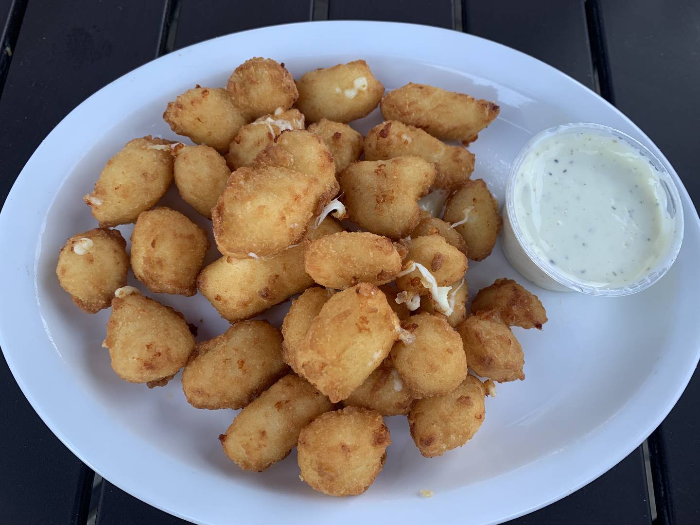 The Wisconsin Cheese Curds at the Rusty Nail Saloon in Ringwood come with homemade ranch dressing. The thin and crisp batter covers flavorful cheese.