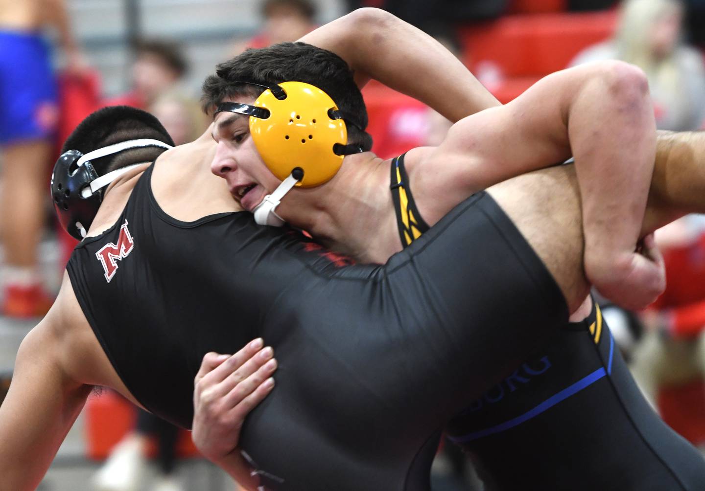 Johnsburg's Duke Mays lifts Marengo's Frankie Solis in the championship match at 190 pounds at the Stillman Valley Holiday Tournament on Saturday, Dec. 20, 2025 at Stillman Valley High School.