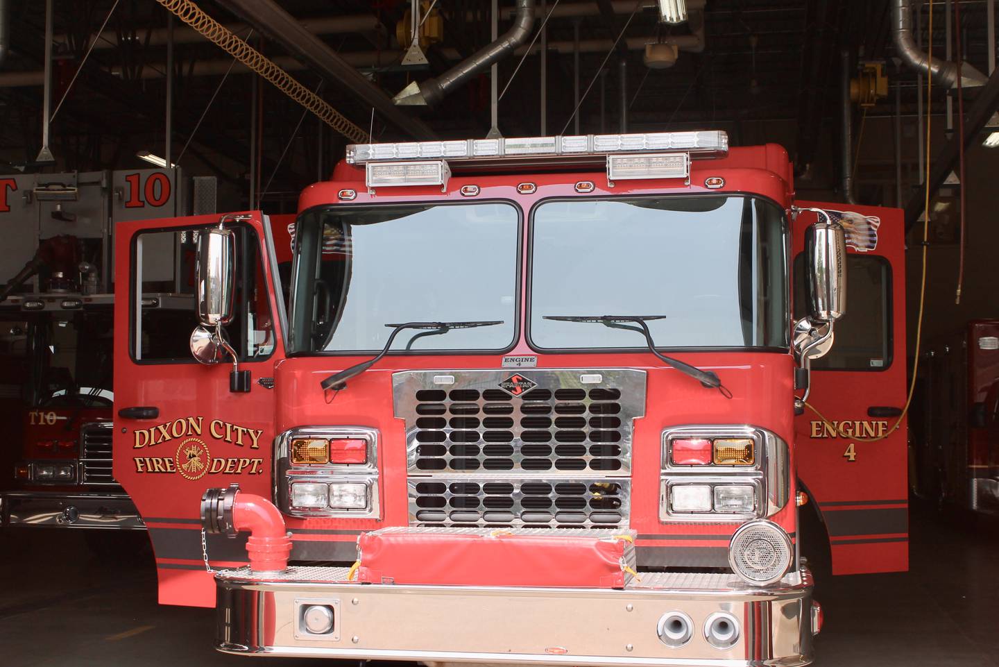 Fire Engine 4 as seen through the bay doors of the Dixon City Fire Department main station on May 19, 2023.