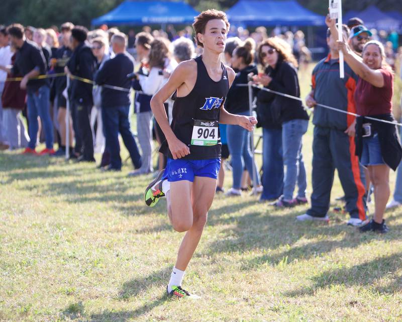 St. Charles North's Samuel Hill heads for the finish line at the St. Charles North Cross Country Invitational on Saturday, Oct. 5,2024 AT LeRoy Oaks Forest Preserve in St. Charles.