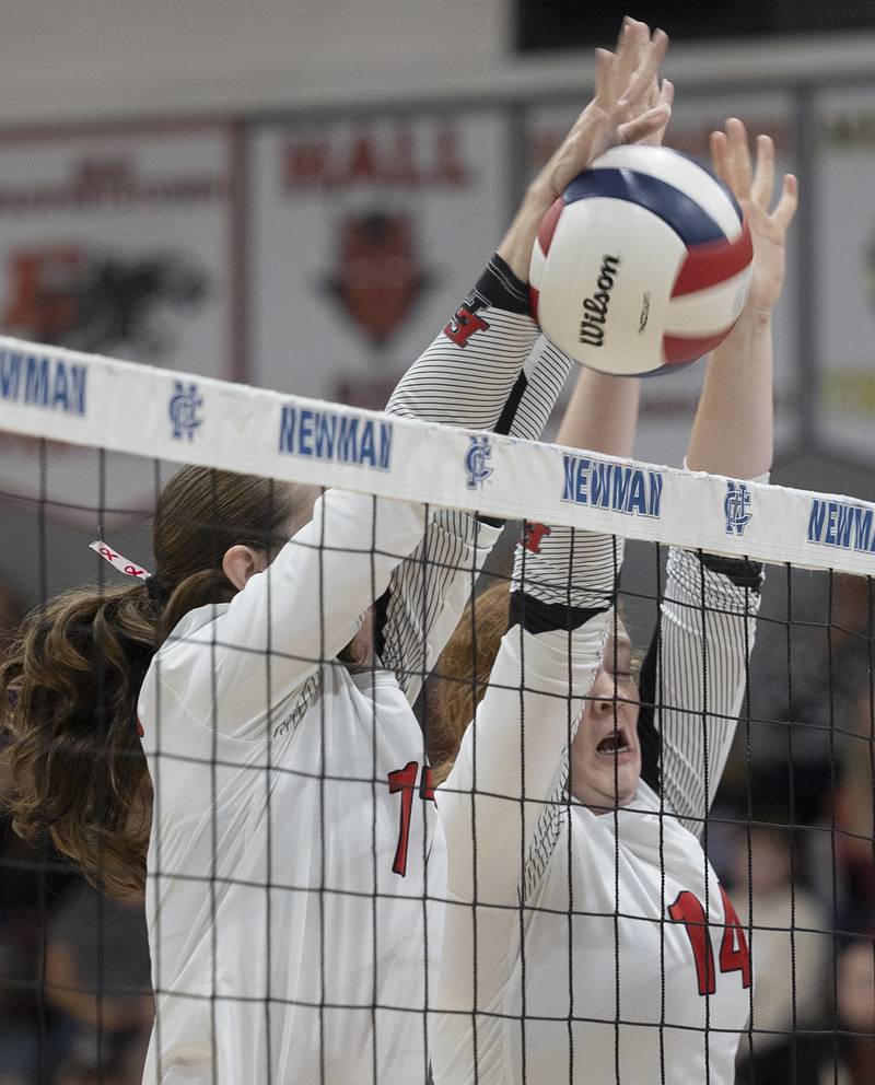 Erie-Prophetstown’s Kayler Pritchard (left) and Eden Jensen go up for a block against Newman Tuesday, Oct. 14, 2025.