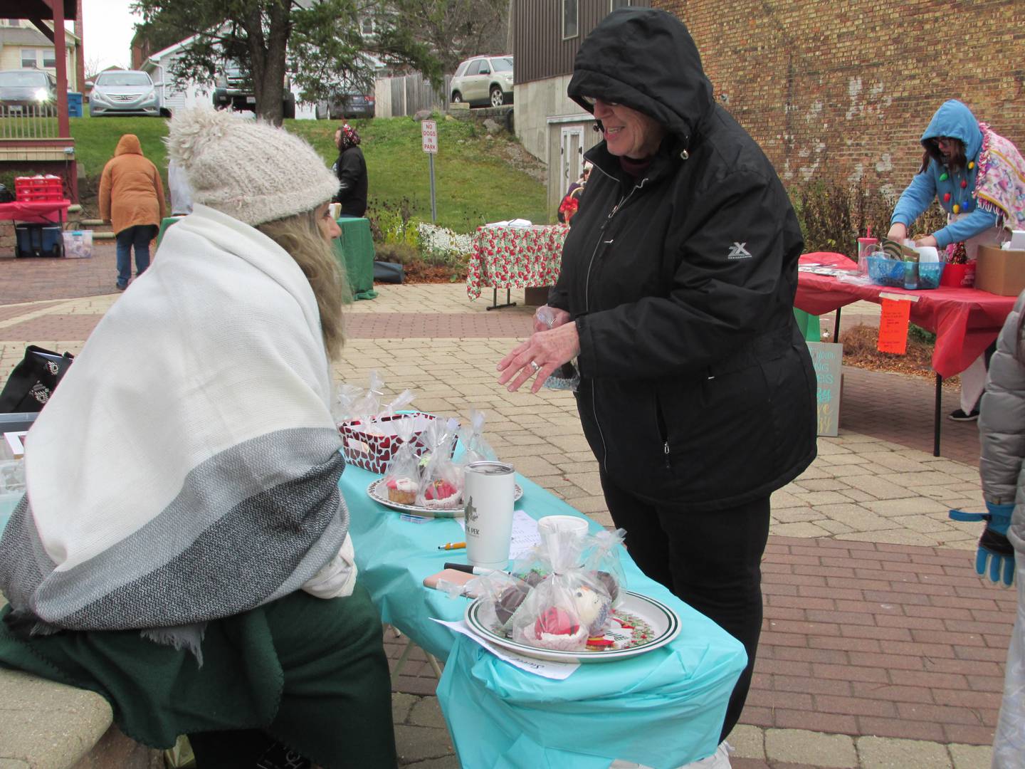 The Sweet Temptation booth sells sweet treats Saturday, Nov. 12, 2022, at Christmas in the Valley in Spring Valley. The vendor market raised money for the Spring Valley Youth Center.