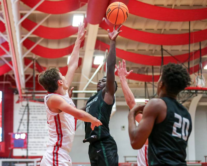 Glenbard West's Teyion Oriental (11) puts up a shot during their basketball game between Glenbard West at Hinsdale Central, Friday  Dec 6, 2024  in Hinsdale.