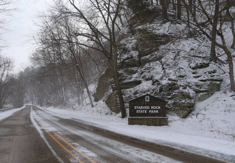 Snow falls near the entrance to Starved Rock State Park on Monday, March 16, 2026 near Utica.