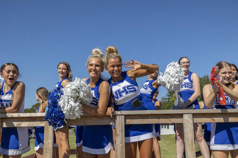 The Newman pom and cheer squad send out smiles Friday, Sept. 20, 2024, during the high school’s homecoming parade.