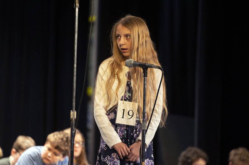 St. Anne Elementary fifth grader Stephanie Delgado appears on stage Thursday, March 9, 2023 during the Lee-Ogle-Whiteside Regional Spelling Bee.