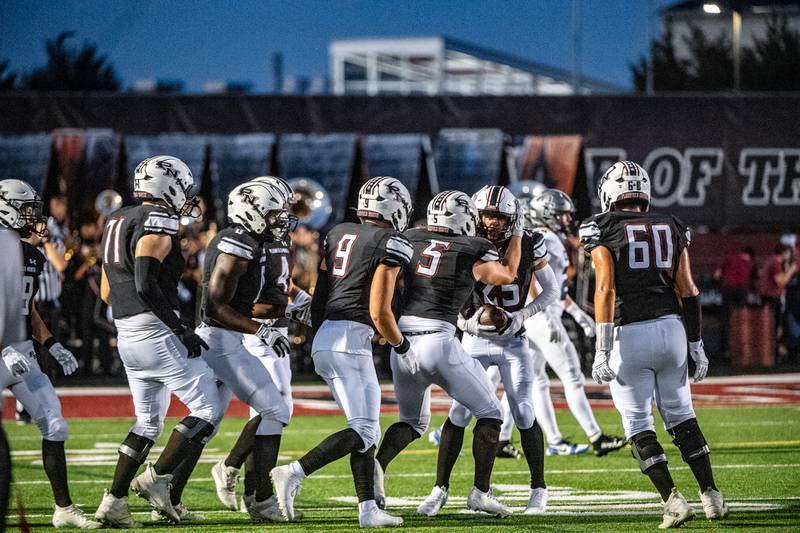 Plainfield North celebrates an interception against Oswego East during a game on Friday Sept. 12, 2025 at Plainfield North High School in Plainfield