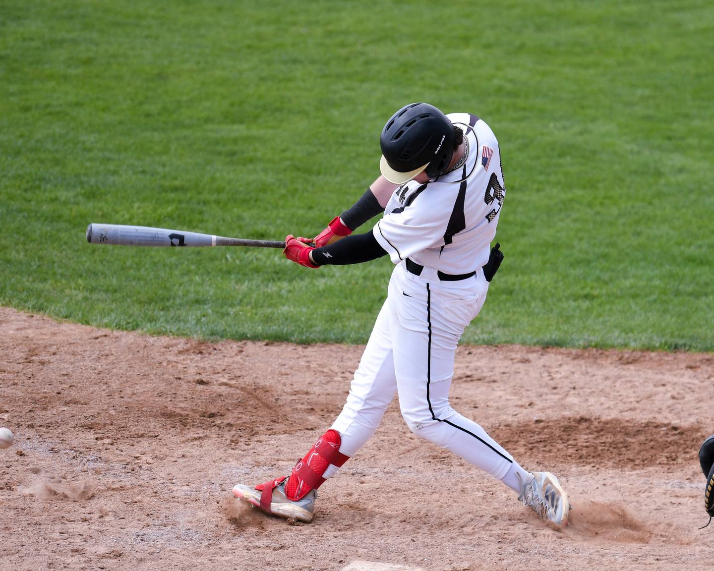 Sycamore's Davis Collie (34) gets a base hit during the game on Saturday May 3, 2025, while taking on DeKalb High School held at Sycamore Park District Sports Complex.