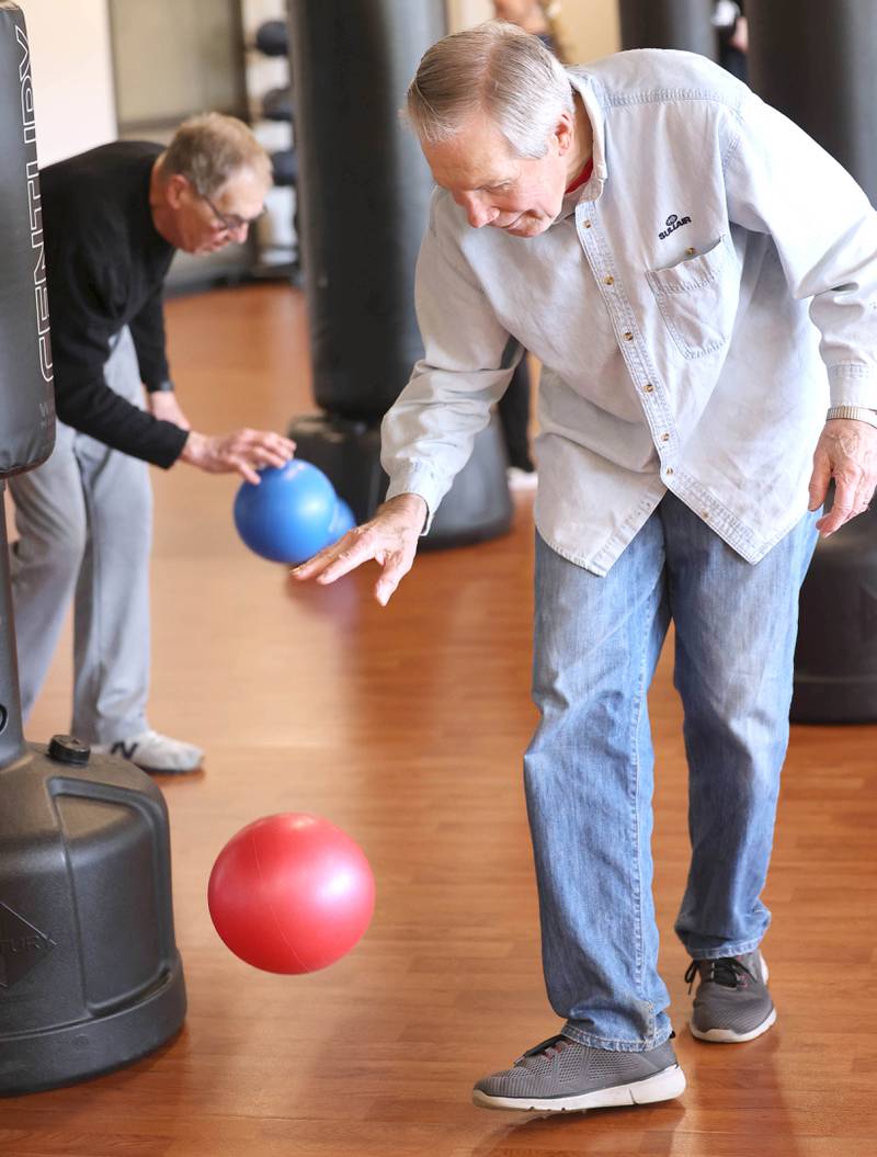 Michael Tiedt dribbles a ball Friday, April 28, 2023, during Rock Steady Boxing for Parkinson's Disease class at Northwestern Medicine Kishwaukee Health & Wellness Center in DeKalb. The class helps people with Parkinson’s Disease maintain their strength, agility and balance.
